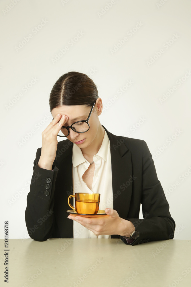 Office life - young business woman with headache, too tired or worried