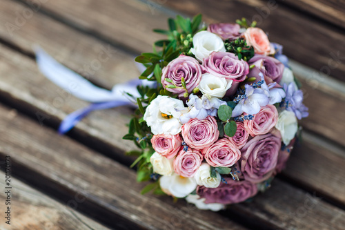 Wedding bouquet on a wooden background