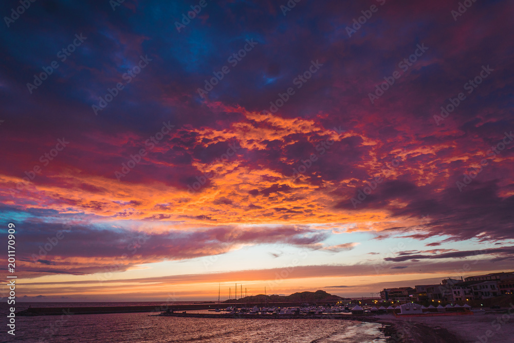 Beautiful sunset and town on coast Beautiful sunset and town on coast