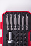 Close-up of set of heads for screwdriver on white background. Isolated. Industry.