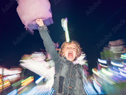 Excited boy with cotton candy