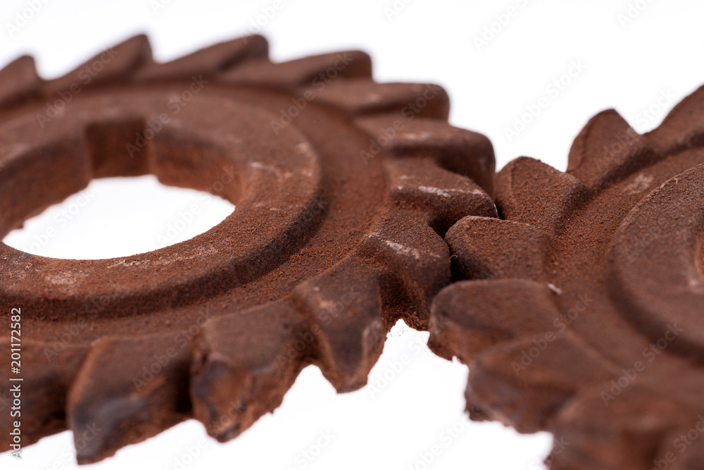 Two incredible rusty chocolate gears. Isolated on white Two incredible rusty chocolate gears. Isolated on white