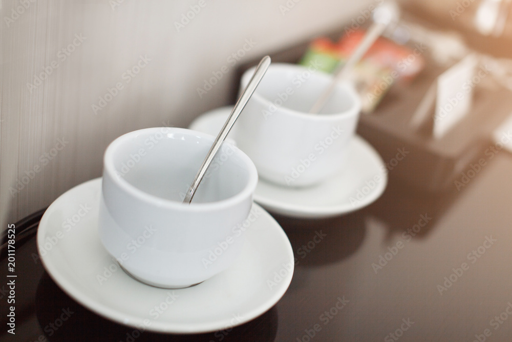Two white empty espresso coffee cups on table, closeup Two white empty espresso coffee cups on table, closeup