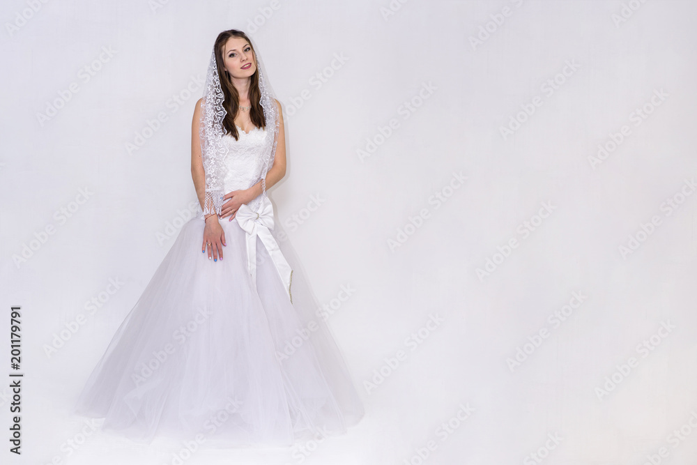 beautiful bride in white wedding dress in different poses on white backgrounds shows different emotions beautiful bride in white wedding dress in different poses on white backgrounds shows different emotions