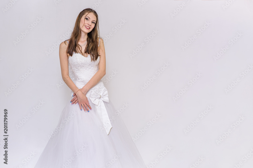 beautiful bride in white wedding dress in different poses on white backgrounds shows different emotions beautiful bride in white wedding dress in different poses on white backgrounds shows different emotions