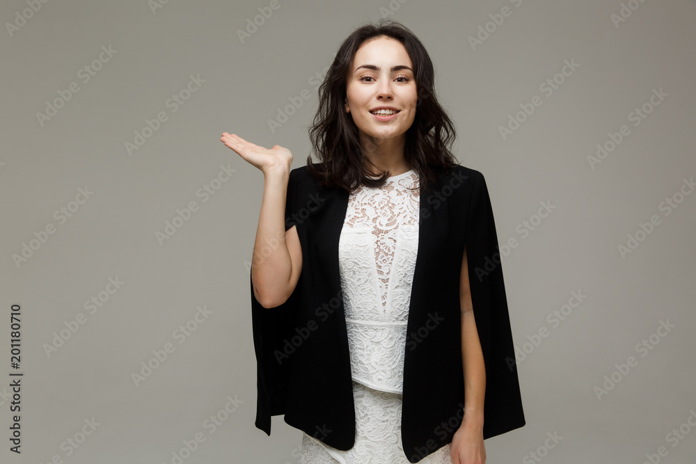 Beautiful fashionable woman in a white dress Beautiful fashionable woman in a white dress