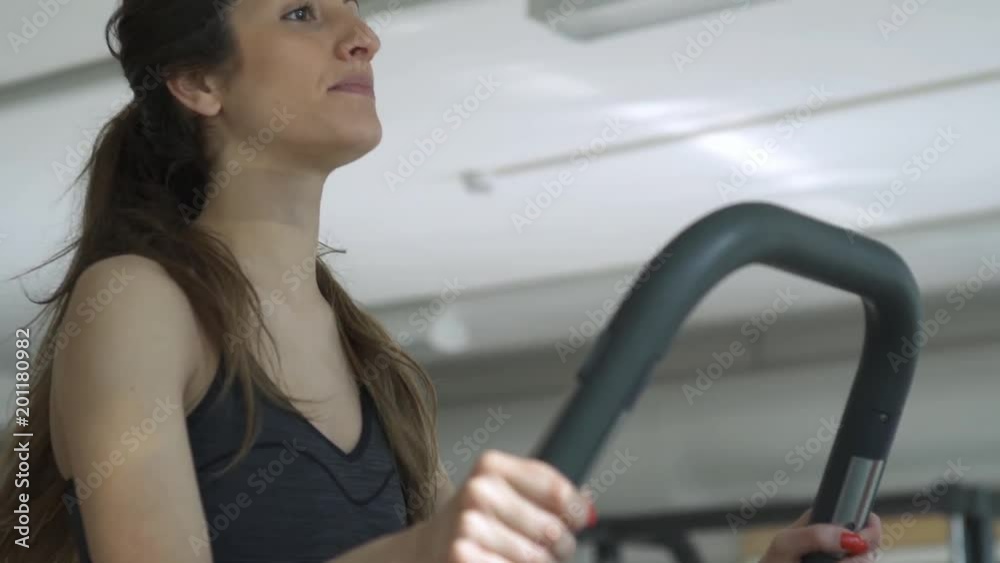 Sporty woman doing a treadmill workout Sporty woman doing a treadmill workout