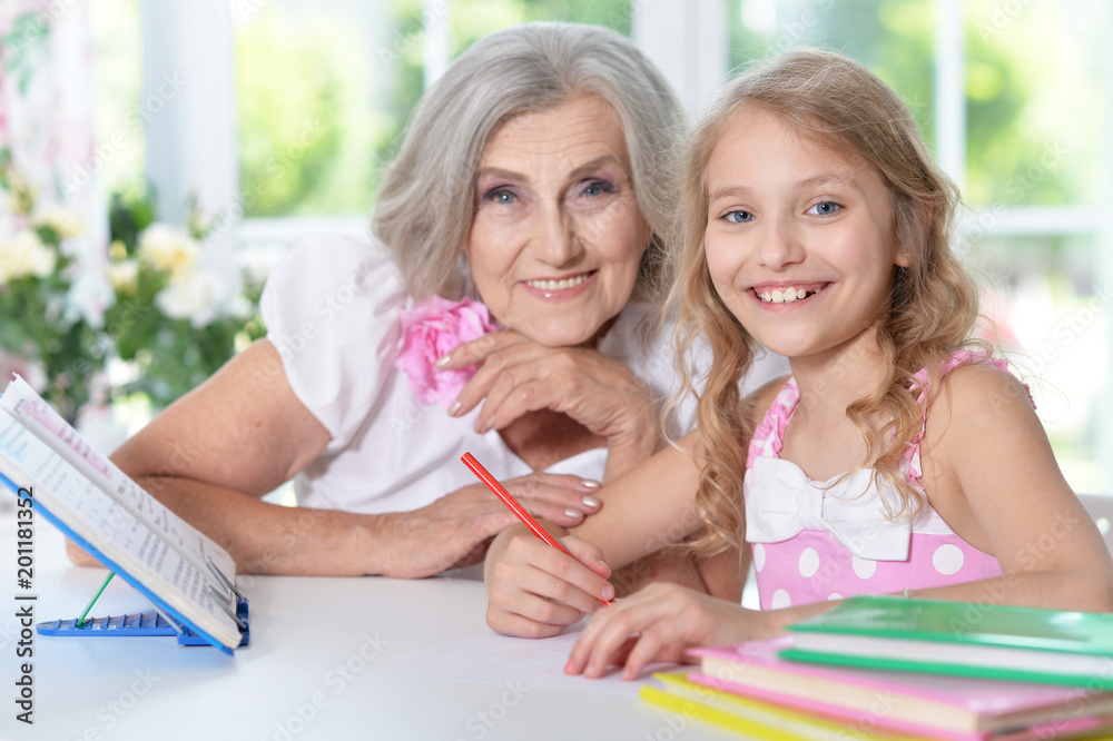 grandmother and granddaughter doing homework grandmother and granddaughter doing homework