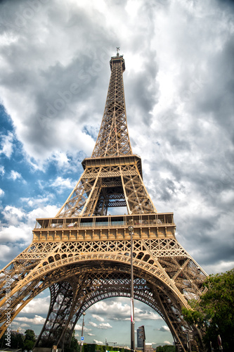 Eiffel Tower in Paris, France. Tower on cloudy sky. Architecture structure and design concept. Summer vacation in french capital © be free