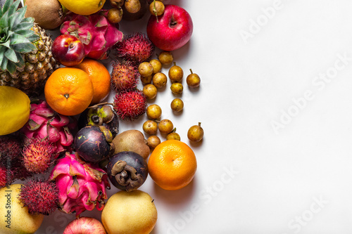 Mixed fruits  flat lay image on white background with copy space.