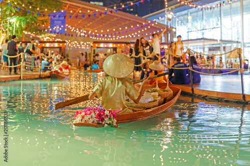Photography Bangkok / Thailand - April 12 2018: artificial floating market, People sell in the boat at Songkarn Fair, King Power in Bangkok