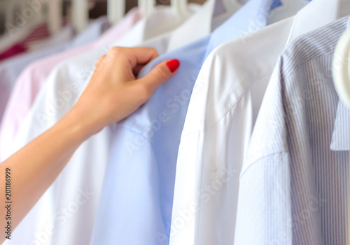 ironed shirts in the closet, selection