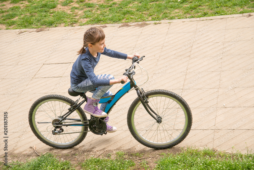 Girl rides a bike