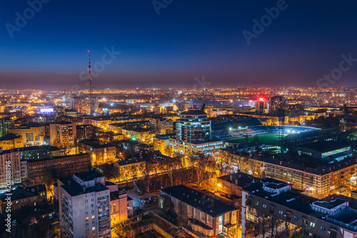Aerial view of night Voronezh downtown. Voronezh cityscape at blue hour. Urban lights, modern houses, television tower, stadium © Mulderphoto