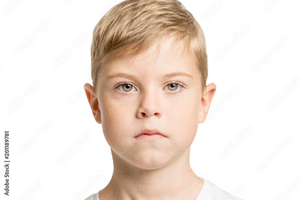 Cute serious boy with big blue eyes, isolated on white background Cute serious boy with big blue eyes, isolated on white background