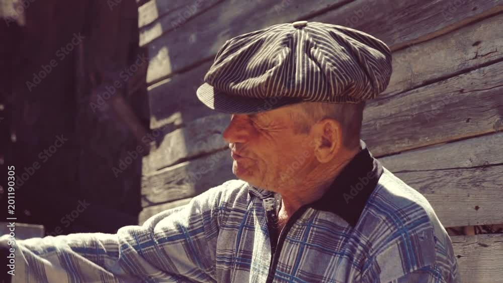Portrait of an old man in a village near workshops Portrait of an old man in a village near workshops