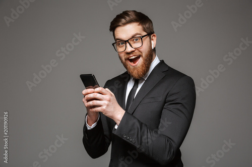 Portrait of an excited young businessman