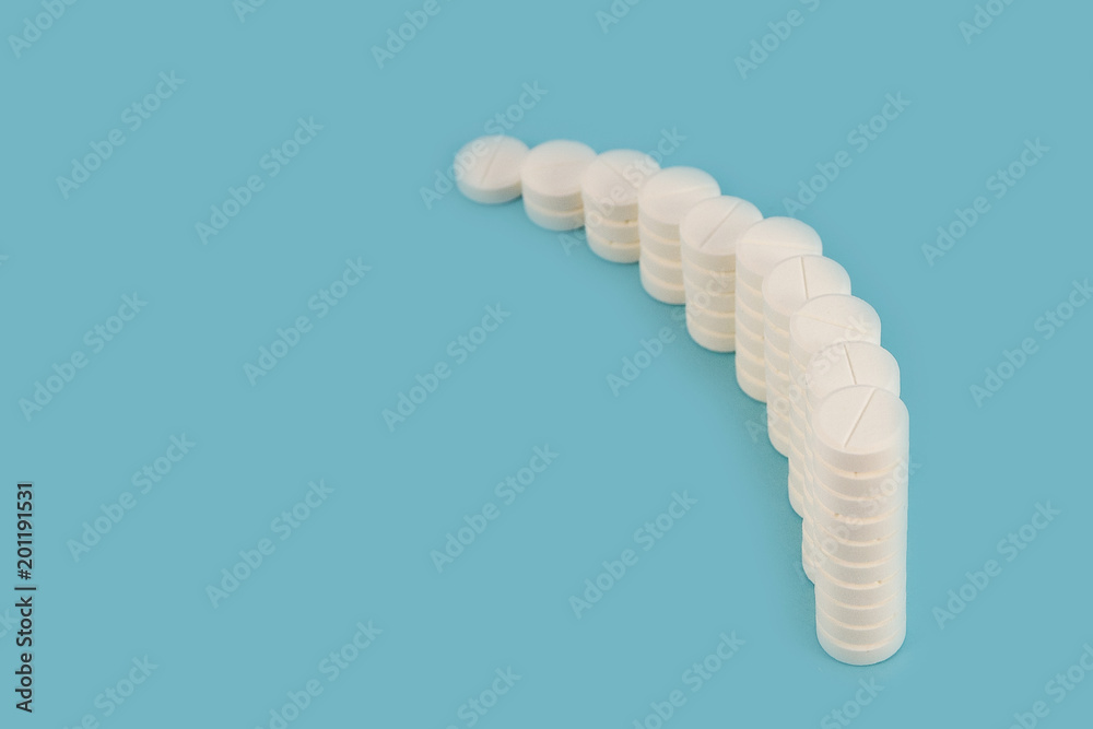 Curved row of columns with white tablets on a blue background. Curved row of columns with white tablets on a blue background.