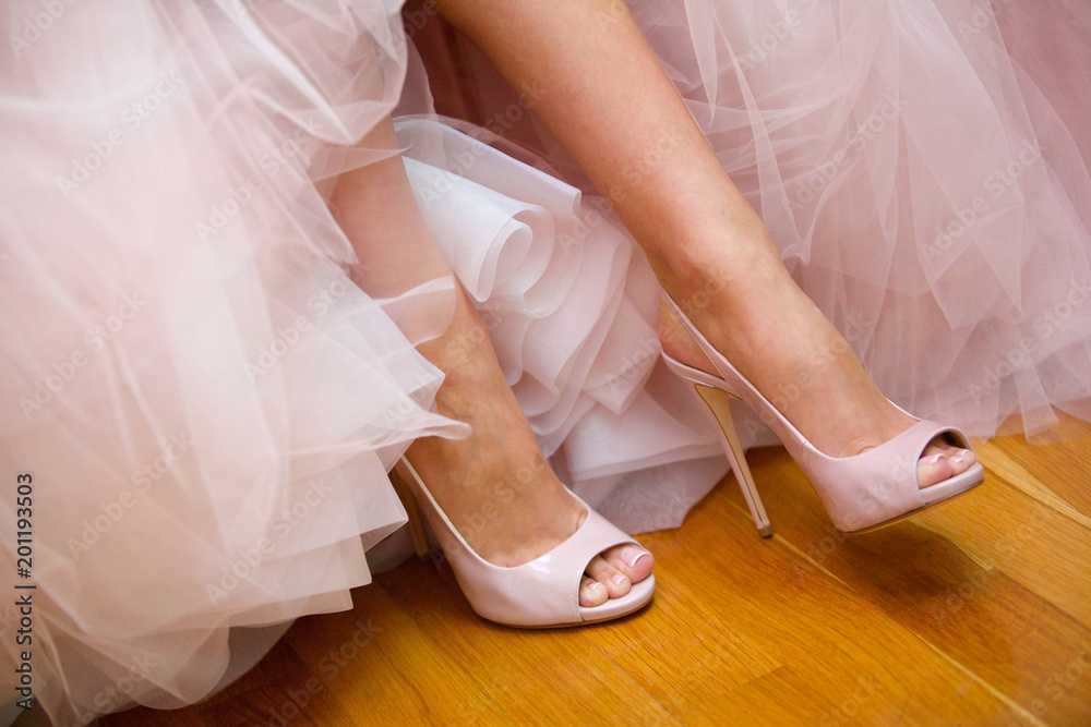Shoes white cleandata on legs young girl girl bride in a white dress.
