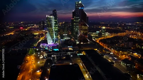 Stunning aerial drone view on bright evening night Moscow city illumination in busy metropolis downtown cityscape