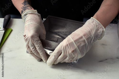 Step-by-step preparation of black designer cake. Preparation of a baking dish.