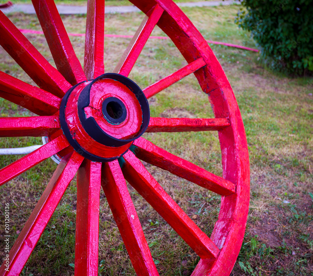 wooden red wagon wheel 
