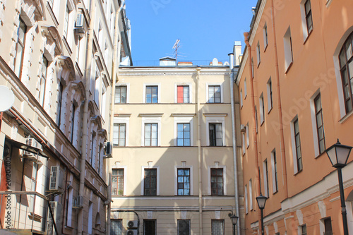 Well Yard in Saint Petersburg Russia. Famous City Courtyards Built in Shape of a Well, with Small Space between Building Facades. Modern City Symbol, House Exterior View from Classic well-Yard. © onajourney