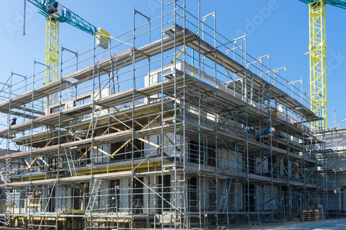 construction site of a building - cranes in the background