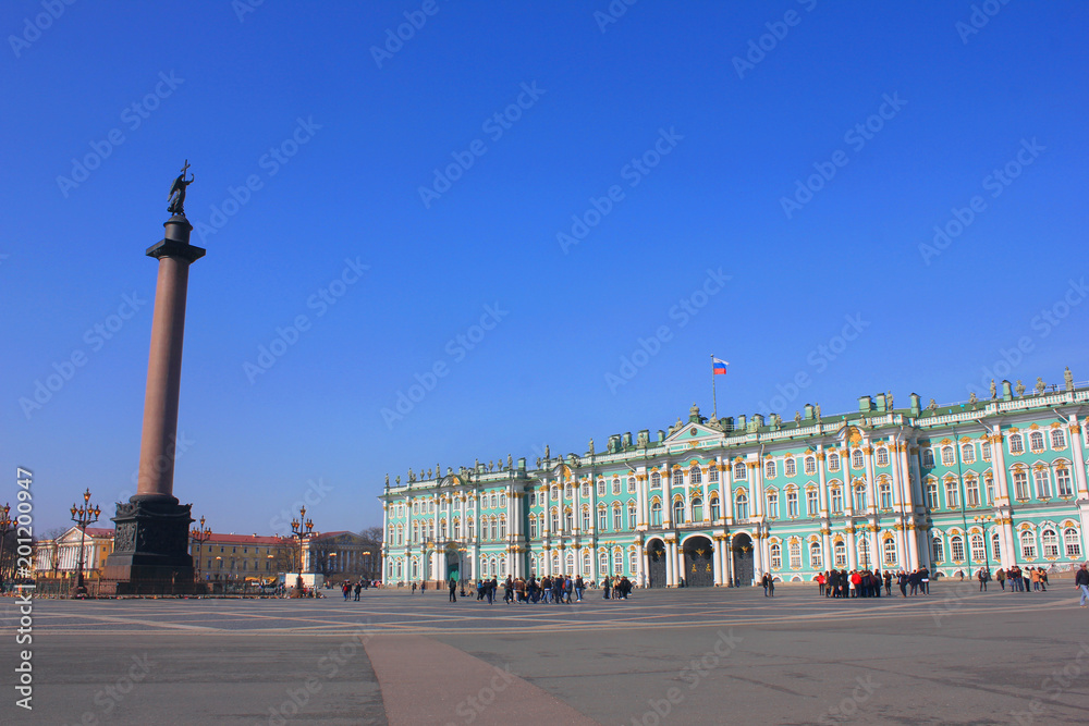 Palace Square Historic Architecture with Winter Palace Building and Alexander Column in St. Petersburg, Russia. Main City Square Summer Scene, Famous Travel Landmark on Blue Sky Sunny Day Background.