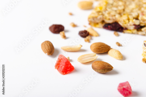 Mix of nuts, dried fruits, raisins on white background