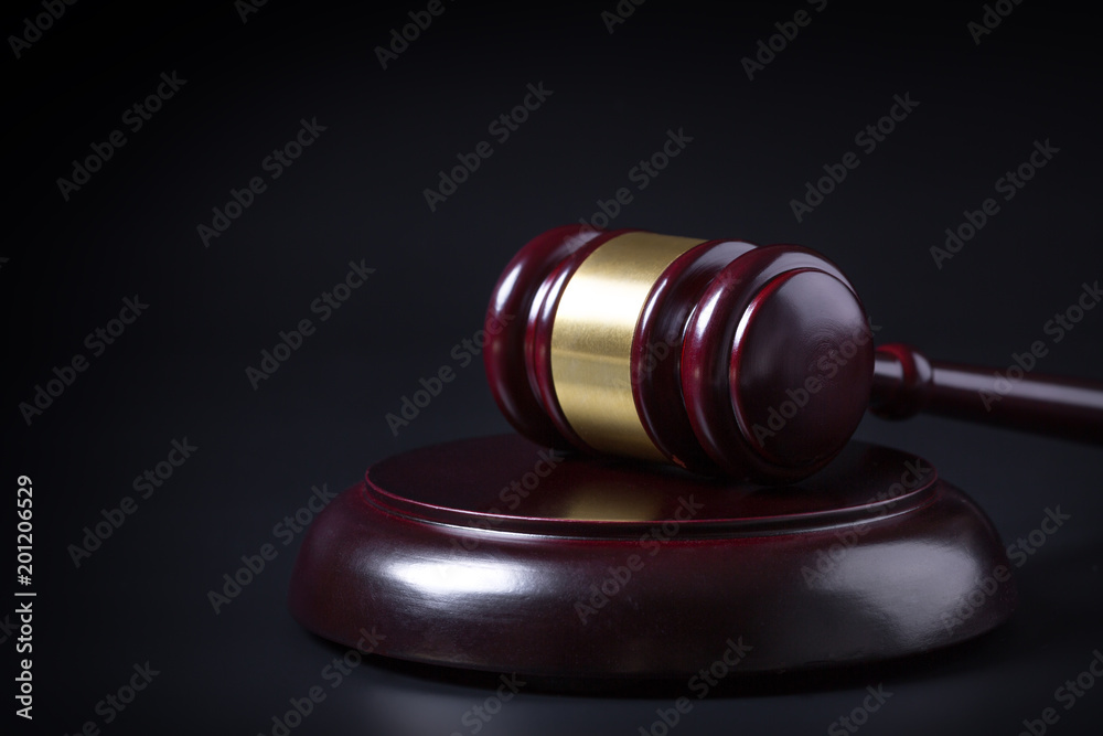 Wooden judge gavel isolated on black background