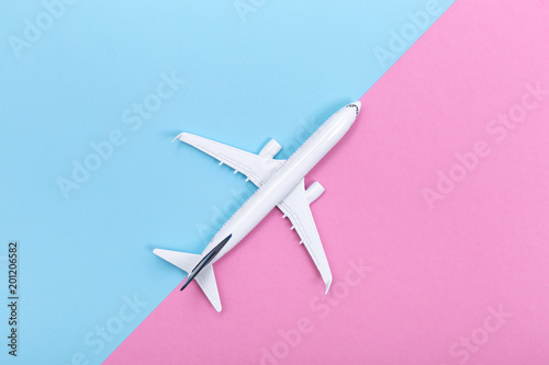 White blank model of passenger airplane on serenity colored paper texture