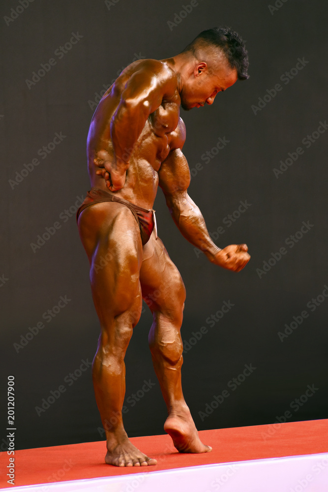 Bodybuilder performing a side chest pose at a fitness and figure  competition in Haifa Israel Stock Photo - Alamy