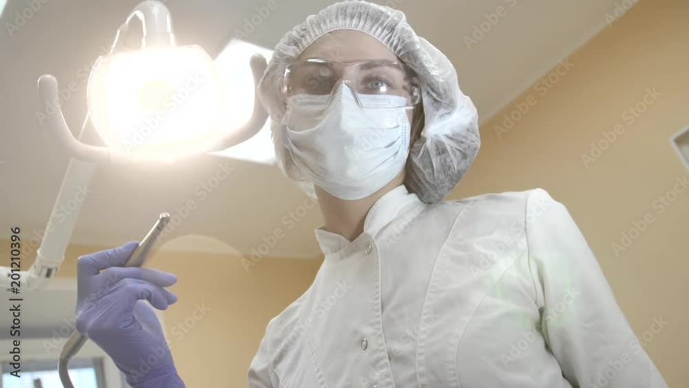 Dentist at work in clinic, doctor during visit of client. Patient point of view