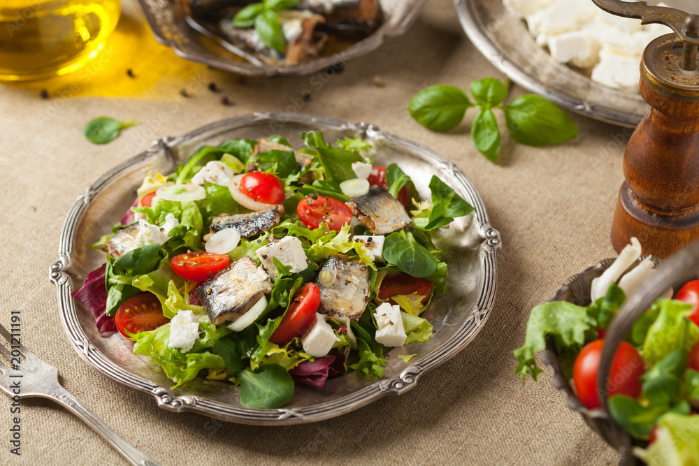 A delicious salad with sardines and feta cheese. A delicious salad with sardines and feta cheese.