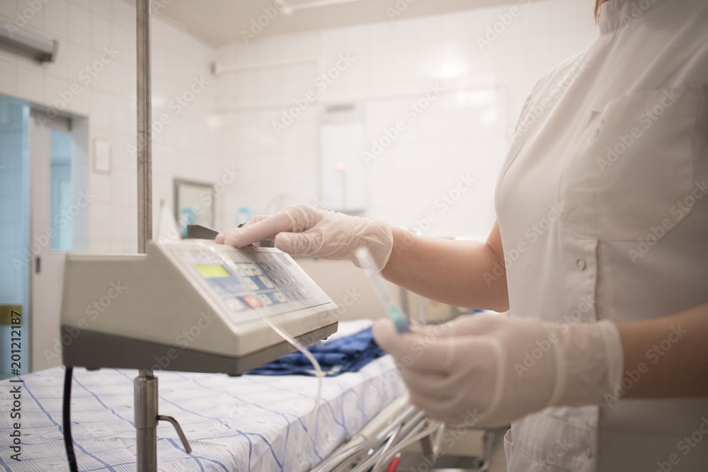 doctor with an infusion in the hospital, intensive care unit doctor with an infusion in the hospital, intensive care unit