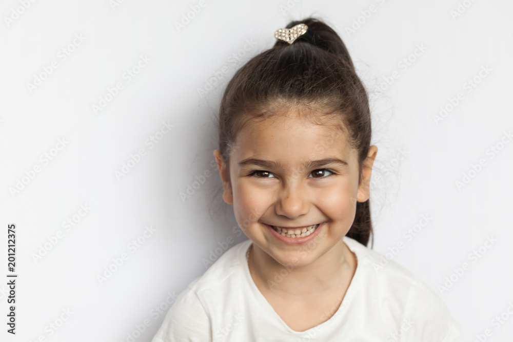 Portrait of happy cute brunette child girl with long hear isolated on white background Portrait of happy cute brunette child girl with long hear isolated on white background
