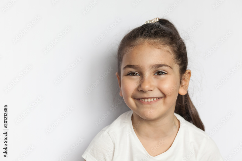 Portrait of happy cute brunette child girl with long hear isolated on white background Portrait of happy cute brunette child girl with long hear isolated on white background