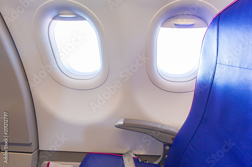 Empty seat at the window of passenger airplane