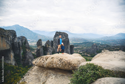 Father and Daughter on Top of Rock photo