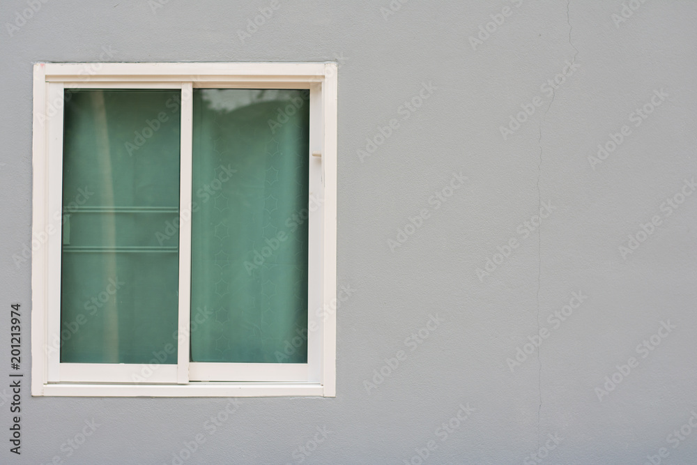 Glass window sliding on gray
wall interior house.
