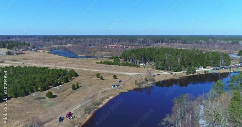 Aerial View Flight over the beach coast, melting ice. Aerial view over sandy coast, lake, forest and snow. Aerial View Flight over the beach coast, melting ice. Aerial view over sandy coast, lake, forest and snow.