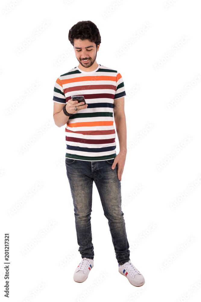 Fototapeta premium standing young man holding his phone
