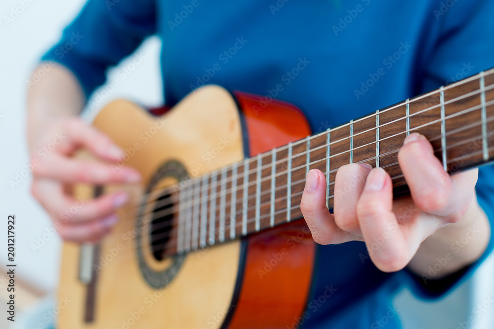 Woman playing a guitar