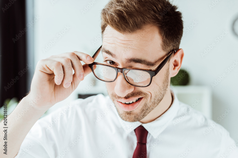 handsome smiling businessman winking in glasses handsome smiling businessman winking in glasses