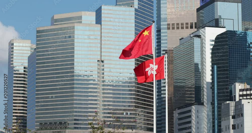 Business tower and Hong Kong and China flag