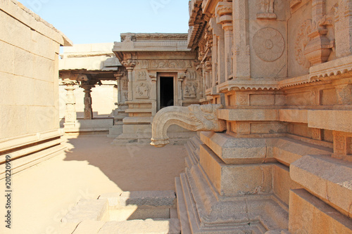 Carving details on the outer wall of Hazara Rama Temple. Hampi, Karnataka, UNESCO. Indian God carving stone photo