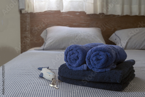 Fototapeta Naklejka Na Ścianę i Meble -  Hotel room. Towels on the bed.