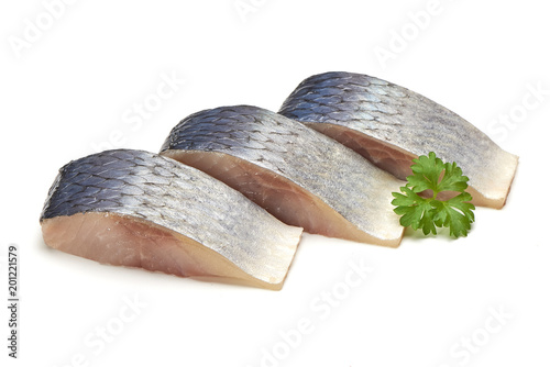 Pieces of Mackerel with herbs isolated on white background photo