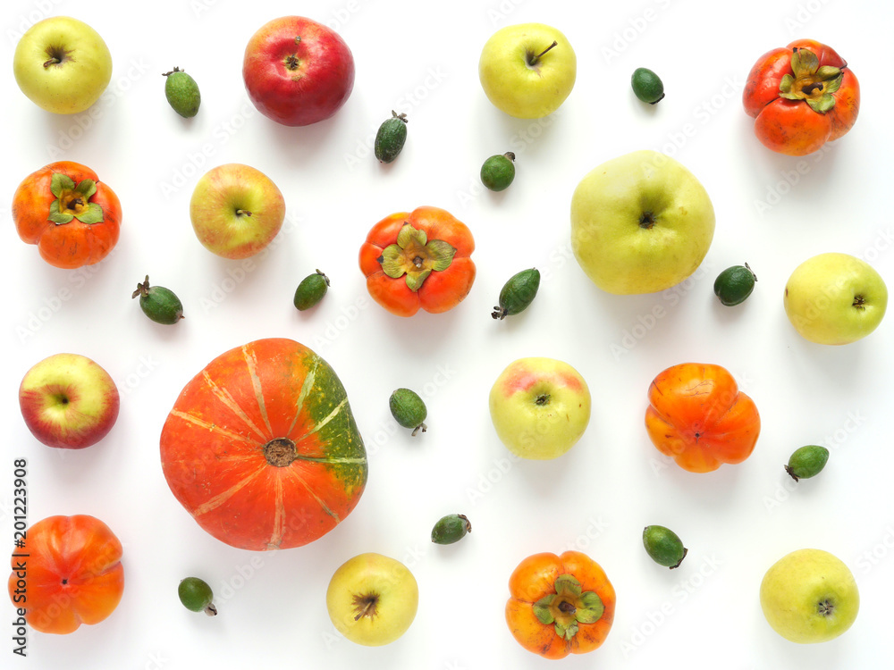 Autumn concept. Pumpkin, grapes,persimmon, red and green apples on a white background. Pattern of fresh vegetables. Top view, flat lay. composition of fresh vegetables and fruits. Autumn concept. Pumpkin, grapes,persimmon, red and green apples on a white background. Pattern of fresh vegetables. Top view, flat lay. composition of fresh vegetables and fruits.